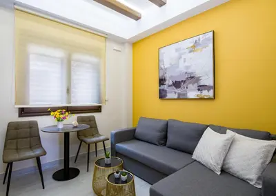 a living room with a couch and a table at Aretousa Suites in Chania Town