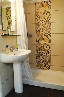 a bathroom with a sink and a shower at Neapolis Apartments in Palaiochóra