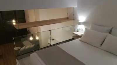 a living room with a couch and a glass table at Sixteen All Seasons House in Chania Town