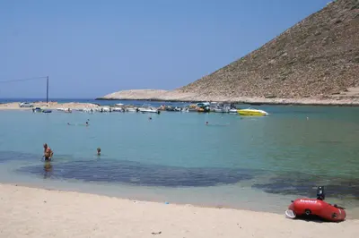 a group of people in the water at a beach at Villa Anemi in Stérnai