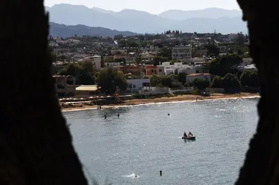 a group of people in a boat in the water at Iolkos Hotel Apartments in Kato Daratso