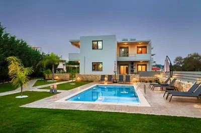 a house with a swimming pool in the yard at Kagiemar Luxury House in Perivólia