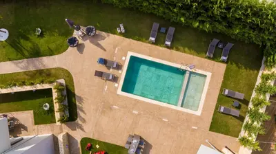 an overhead view of a swimming pool in a yard at Amaen Luxury House in Perivólia