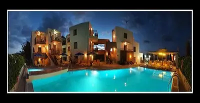 a large swimming pool in front of a building at Alexandros M in Maleme