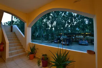 a view of a parking lot with cars parked at Flisvos Rooms in Palaiochóra