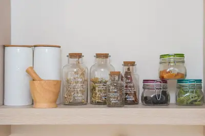 a shelf with jars and other items on it at Ontas Villa Loutraki Platanias in Gerani Chanion