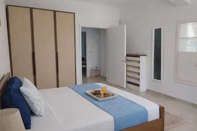a bedroom with a bed with a tray of food on it at Konstantina's cottage Ideal BaseforBalos & Elafonisi in Kissamos