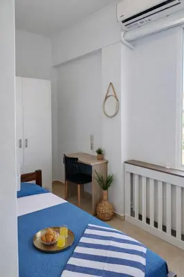 a bedroom with a bed with a plate of food on it at Konstantina's cottage Ideal BaseforBalos & Elafonisi in Kissamos