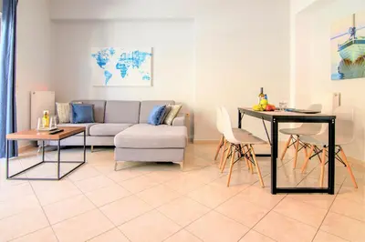 a living room with a couch and a table at Chania Central Flat in Chania Town