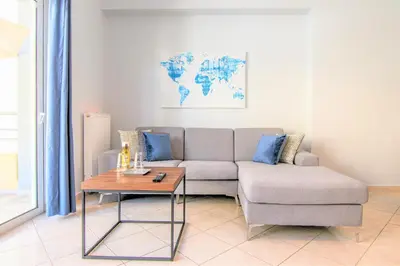 a living room with a couch and a coffee table at Chania Central Flat in Chania Town