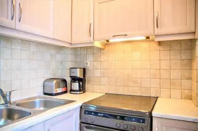 a kitchen with a sink and a counter top at Chania Central Flat in Chania Town