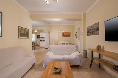 a living room with a bed and a table at Natalia Guest House in Chania Town