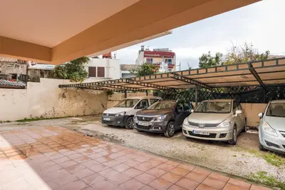 a group of cars parked in a parking lot at Natalia Guest House in Chania Town