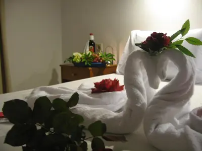 a bed with two towels on top of it at Despina Studios in Agia Marina Nea Kydonias