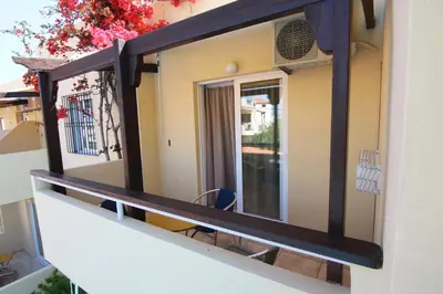 a mirror on the side of a building at Evropi Hotel in Plataniás