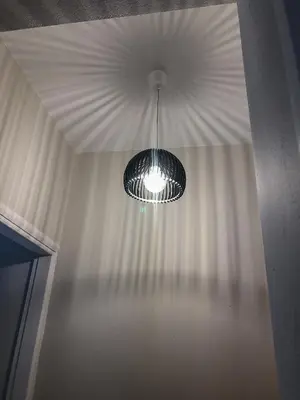 a light hanging from a ceiling in a room at Sofia City Beach 3 Apts Nea Chora Chania steps from the beach in Chania Town