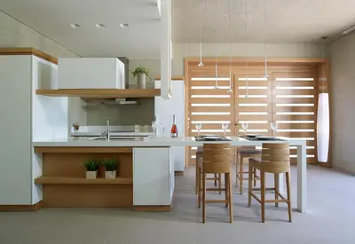 a kitchen with a table and some chairs in it at Youphoria Beach Front Villas in Korfalónas
