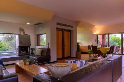 a living room with a couch and a fireplace at Red Castle in Souda