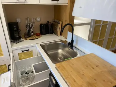 a kitchen with a sink and a counter top at Papaduke House in Kalyves