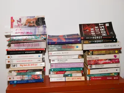 a pile of books sitting on top of a table at Amaryllis in Plataniás