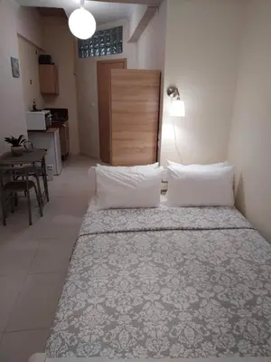 a bedroom with a large bed in a room at Konstantina's studio near the beach in Chania Town