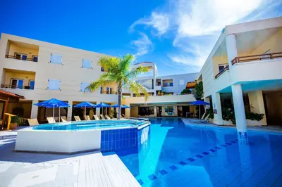 a swimming pool in front of a building at Anais Collection Hotels & Suites in Kato Daratso