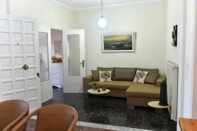 a living room with a couch and a table at Apartment in Koomkapi in Chania Town