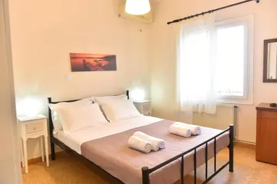 a bedroom with a bed with two towels on it at Apartment in Koomkapi in Chania Town