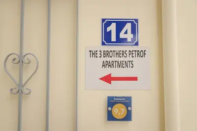 a door with a sign that reads the brothers at The 3 Brothers' Apts in Chania Town