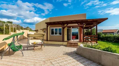 a house with a gazebo on a patio at Villa Helen 200m from the beach in Tersanas BY APOKORONAS-VILLAS in Tersanas