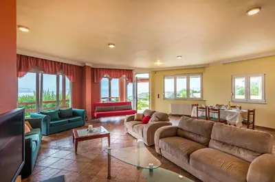 a large living room with couches and a tv at Villa Helen 200m from the beach in Tersanas BY APOKORONAS-VILLAS in Tersanas