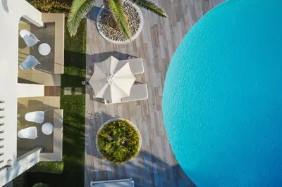 an overhead view of a pool at a resort at Atlantica Amalthia Beach Hotel - Adults Only in Agia Marina Nea Kydonias