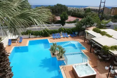 an overhead view of a swimming pool at a hotel at Sunny Suites in Maleme