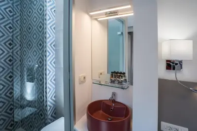 a bathroom with a sink and a mirror at Cretan Berry Portou in Chania Town