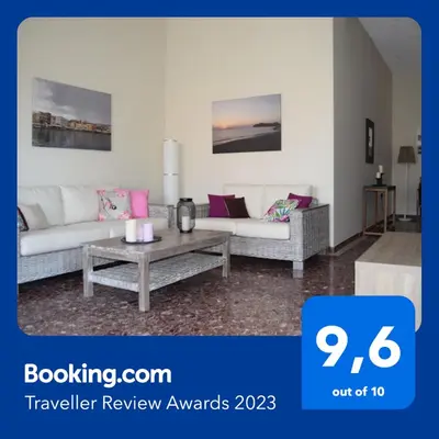a living room with two couches and a coffee table at Modern Apartment with Garden in Kissamos