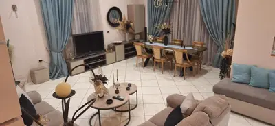 a living room with a couch and a table at Modern Villa in Chania in Perivólia