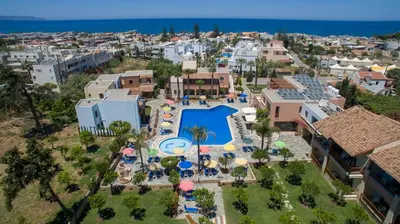 an aerial view of a resort with a swimming pool at Omega Platanias in Plataniás