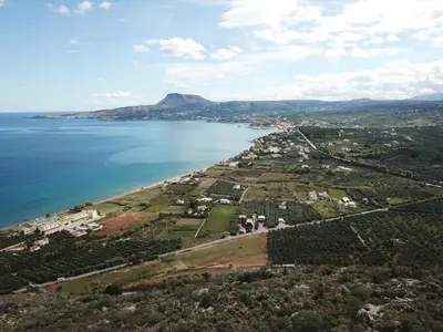 an aerial view of a beach and the ocean at Calma Seaside Villa in Kalyves