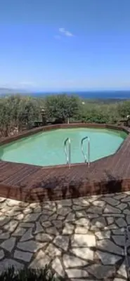 a pool of green water on top of a roof at Drys Villas in Xirokámbion