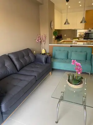 a living room with a couch and a table at Konstantina Apartment near the Beach in Chania Town