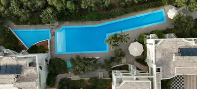 an overhead view of a swimming pool in a resort at Rodon Hotel in Chania Town