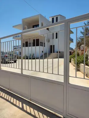 a building with a gate in front of it at Chrisas Apartment Chania in Chania Town