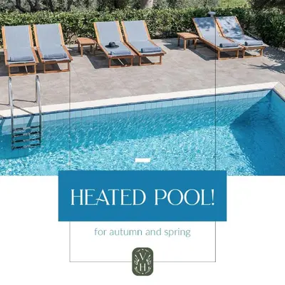 a group of chairs next to a swimming pool at Vilia House on the Hill - Luxury Villa with Heated Pool near Chania in Chania Town