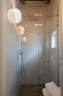 a bathroom with a shower with a glass door at Vilia House on the Hill - Luxury Villa with Heated Pool near Chania in Chania Town