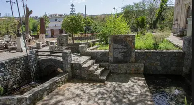 a group of stone stairs in a cemetery at Lydia's Apartment in Stílos
