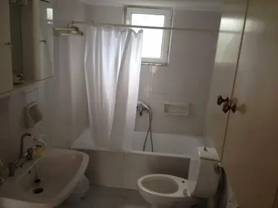 a bathroom with a tub and a toilet and a sink at House with Sea View close to Platanias in Vrísai