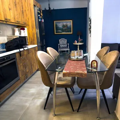 a dining room with a glass table and chairs at A Pleasant Stay in Chania in Chania Town