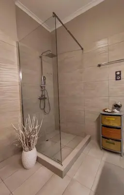 a shower with a glass door in a bathroom at A Pleasant Stay in Chania in Chania Town