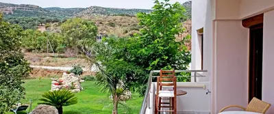 a balcony with a view of a garden at Arodamos Studios & Apts in Kissamos