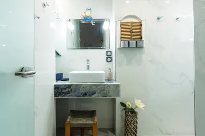 a bathroom with a sink and a mirror at Arodamos Studios & Apts in Kissamos